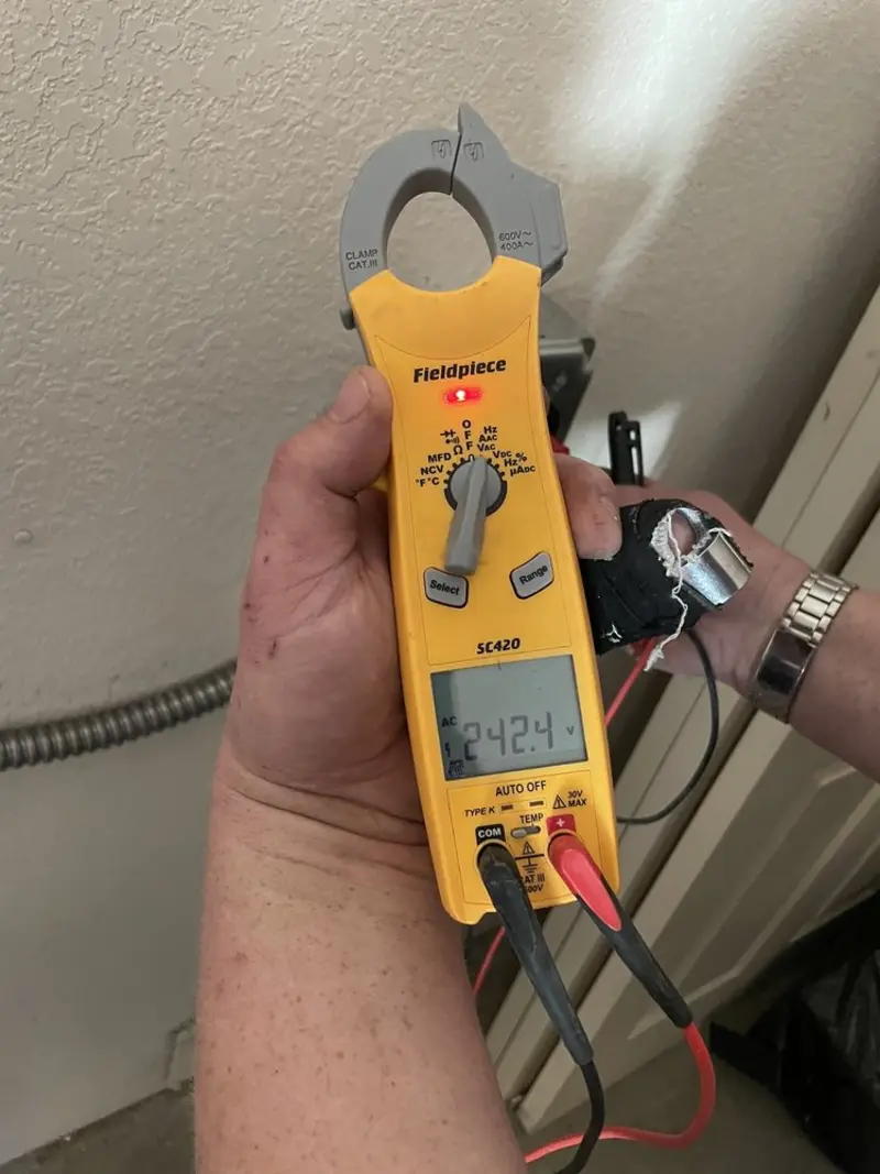 Voltage testing with clamp meter during Hot Tub / Pool Electrical Wiring in Jones